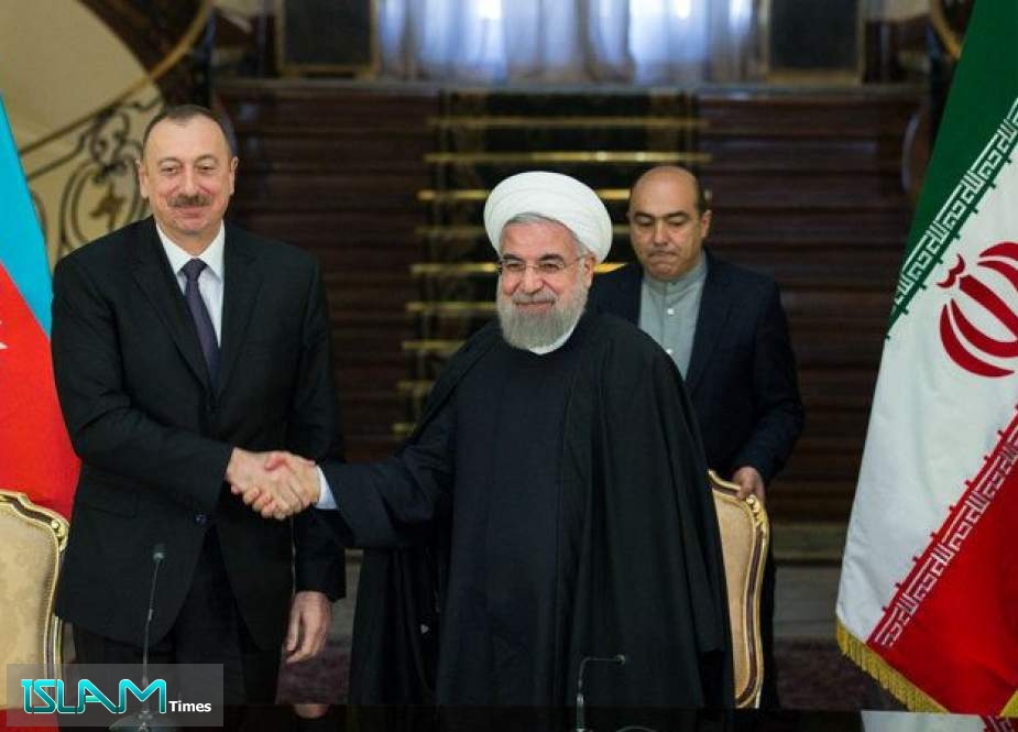 Iranian President Hassan Rouhani and his Azeri counterpart Ilham Aliyev