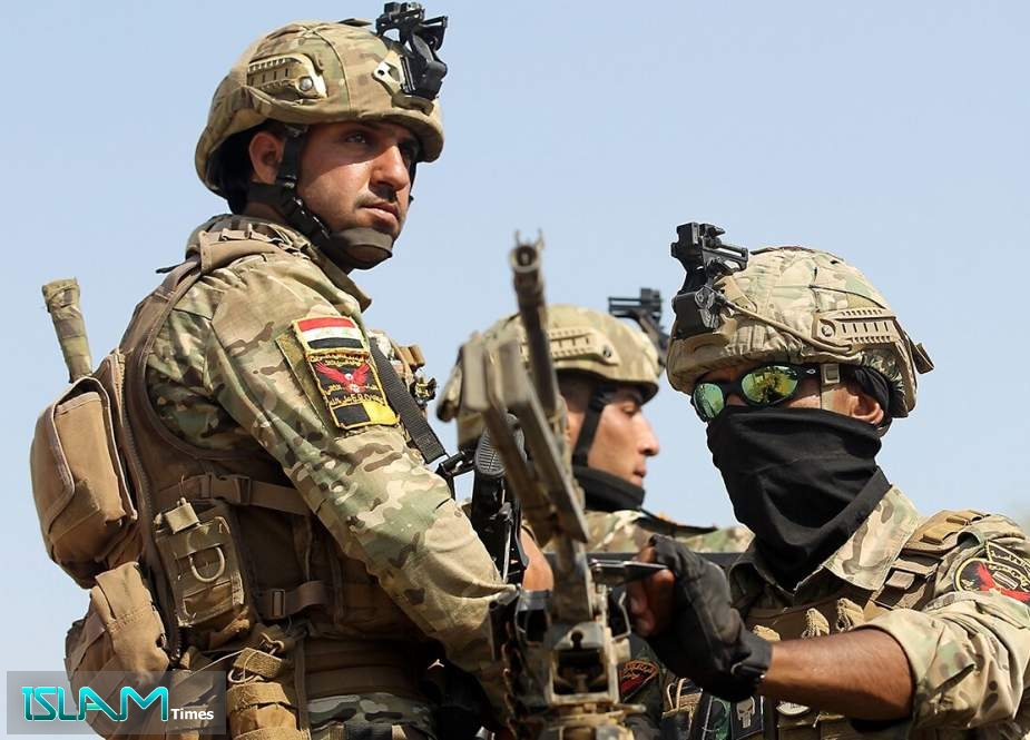 Iraq’s rapid response forces storm a home in the Tarmiyah district, north of Baghdad, searching for wanted Daesh Takfiri terrorists