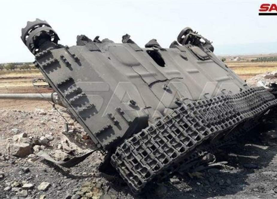Wreckage of a battle tank belonging to foreign-backed Takfiri militants in Tel Aas.jpg