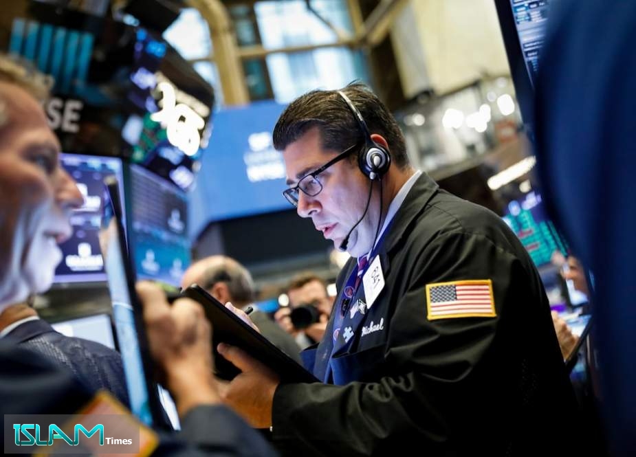 Traders work after the closing bell at the New York Stock Exchange (NYSE) on August 12, 2019 at Wall Street in New York City.