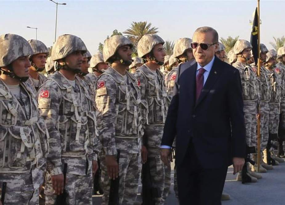 Turkish President Recep Tayyip Erdogan greets Turkish troops