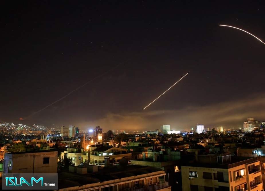 This file photo taken on January 21, 2019 shows Syrian air defense batteries responding to Israeli missiles targeting Damascus.