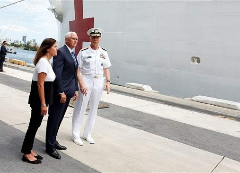 Karen Pence (L), Vice President Mike Pence (C) and Southern Command Admiral Craig Faller (R).jpg
