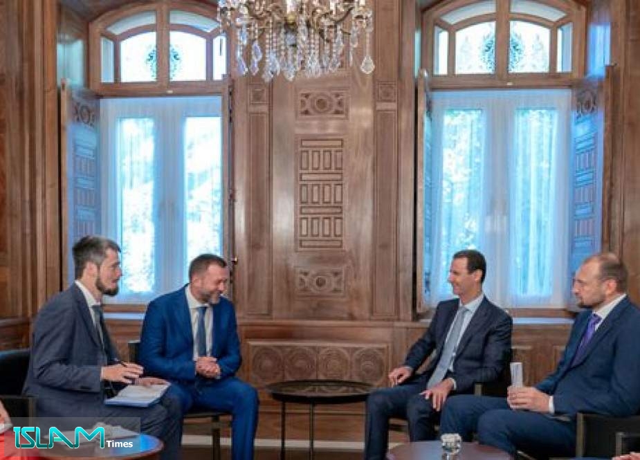 Syrian President Bashar al-Assad (3rd R) meets with a visiting Russian delegation from the ruling United Russia political party in Damascus, Syria, on August 20, 2019.