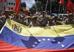 Venezuelan protesters rally against US sanctions with a national flag in Caracas