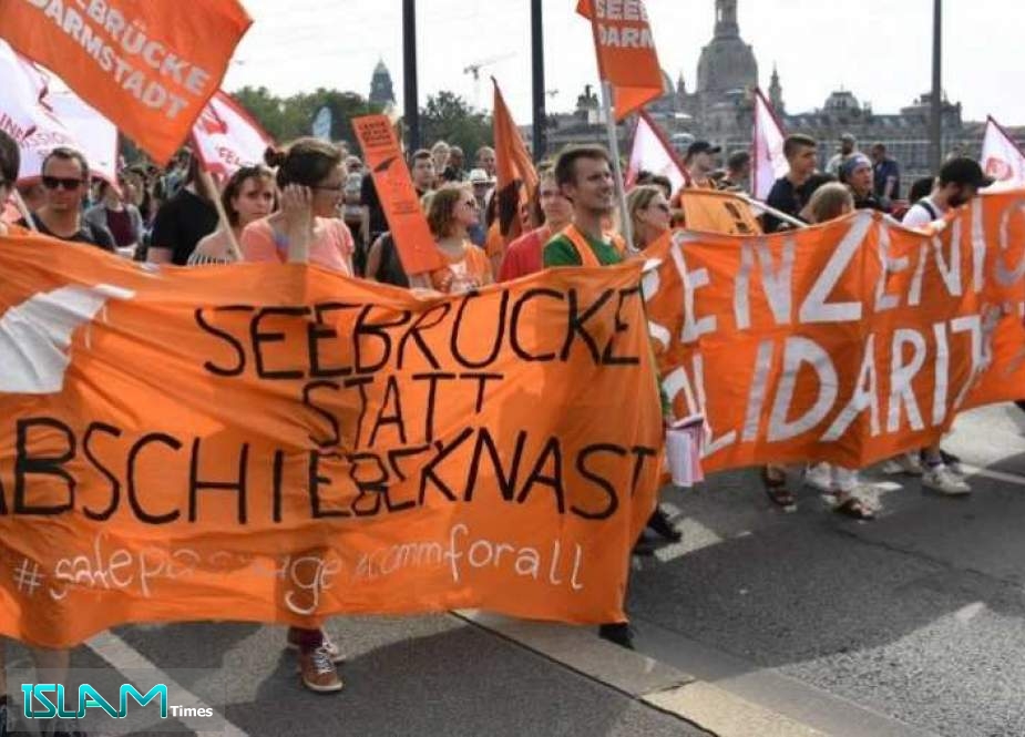 Protesters take part in a demonstration titled "Unteilbar" (indivisible) against racism on August 24, 2019 in Dresden, eastern Germany.