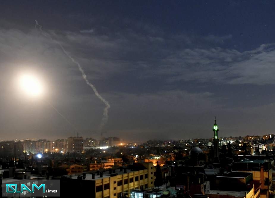This photo released by the Syrian official news agency SANA, shows missiles flying into the sky near international airport, in Damascus, Syria, on January 21, 2019.