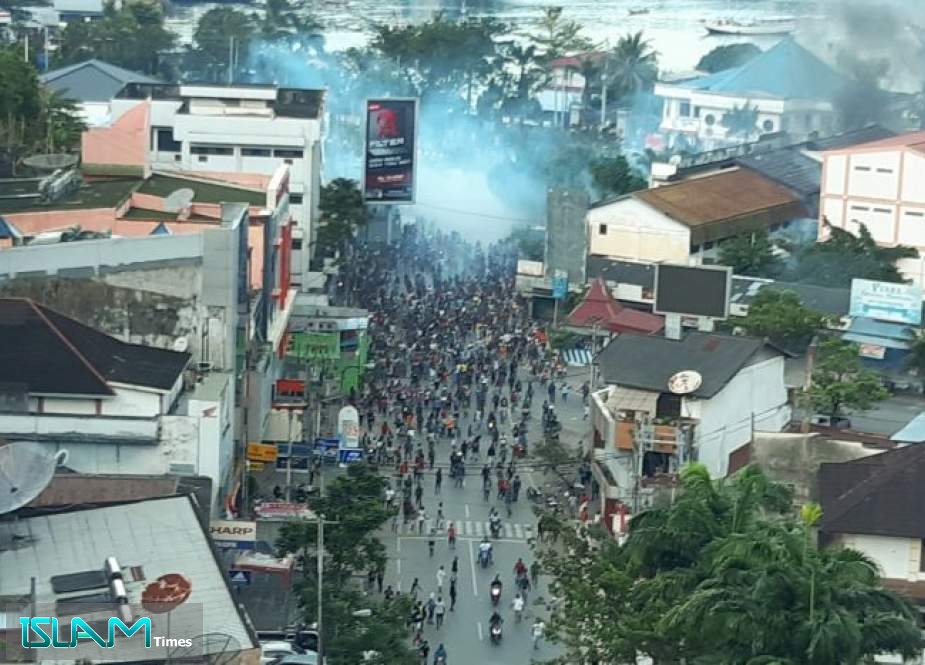 Police and protesters are seen clashing in Jayapura, Papua, Indonesia