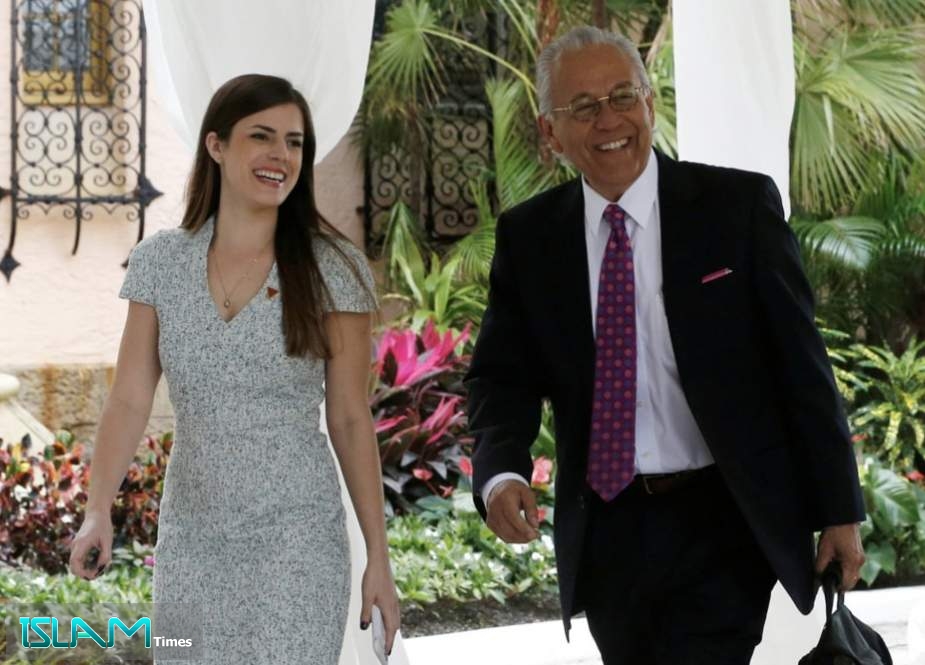 Personal assistant Madeleine Westerhout escorts former US Representative Henry Bonilla to meet US President Donald Trump at the Mar-a-lago Club, Florida, on December 30, 2016.