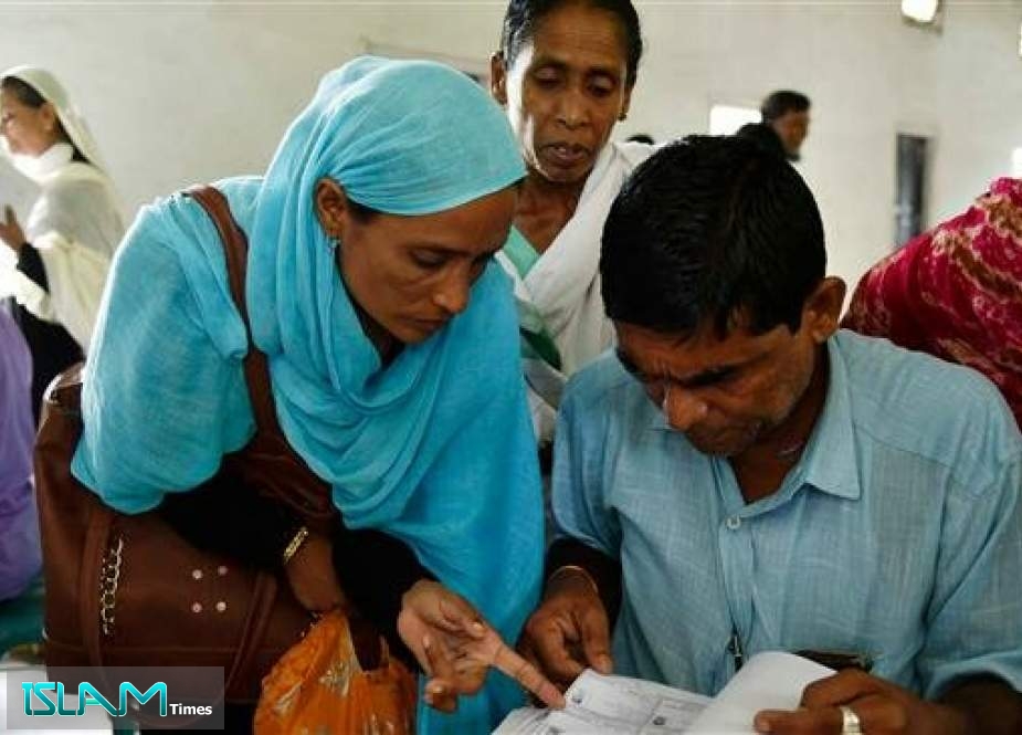 People check their names on the final list of the National Register of Citizens (NRC) at Buraburi village in Morigaon district of Assam, India, August 31, 2019.