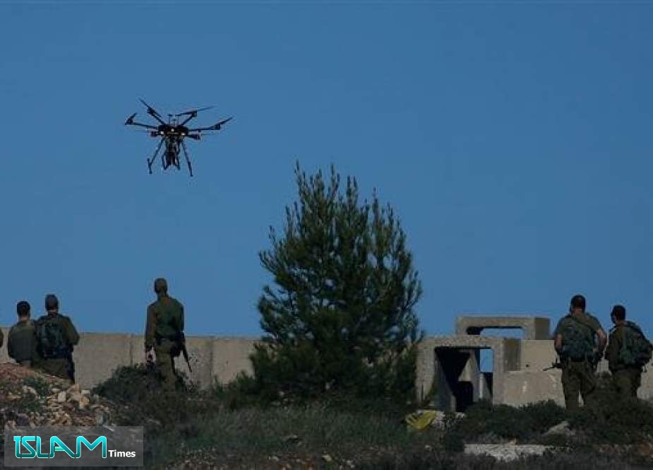 Israeli soldiers look at a drone prepared to throw gas canisters during clashes with Palestinian protesters in Ramallah, near the settlement of Beit El, in the occupied West Bank on December 14, 2018