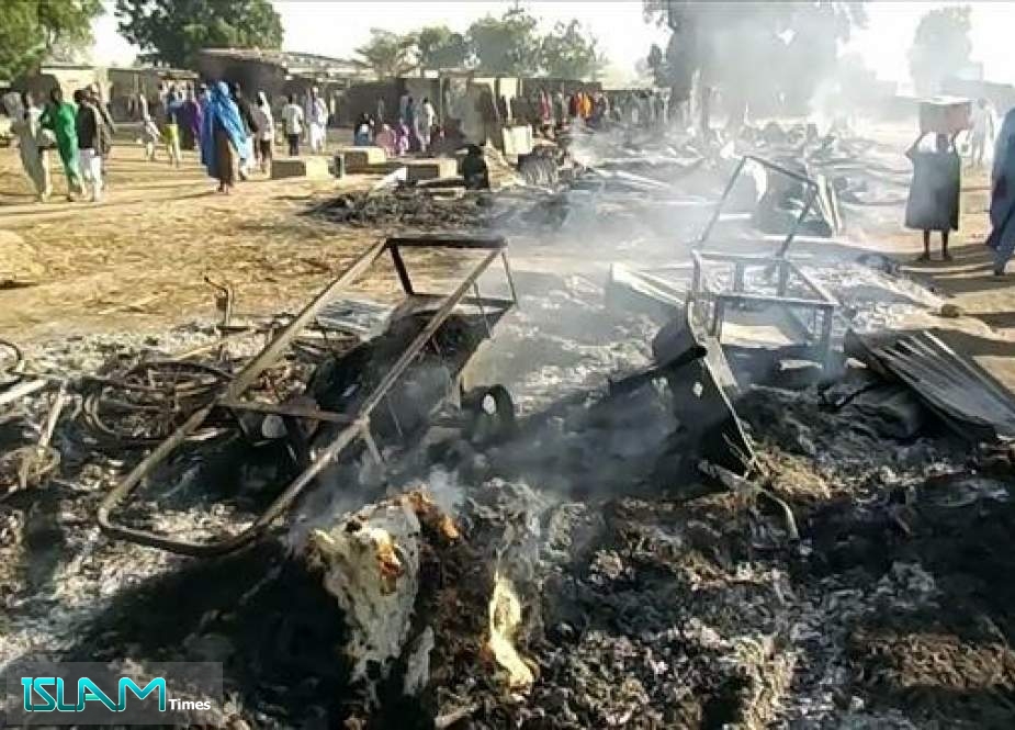 Smoldering ashes and charred items are seen on the ground in Budu near Maiduguri on July 28, 2019 after an attack by Boko Haram terrorists.