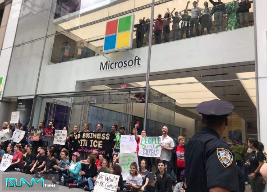 Protestors block the entrance of a Microsoft store in midtown Manhattan during a rally against the US immigration policy on September 14, 2019 in New York City.