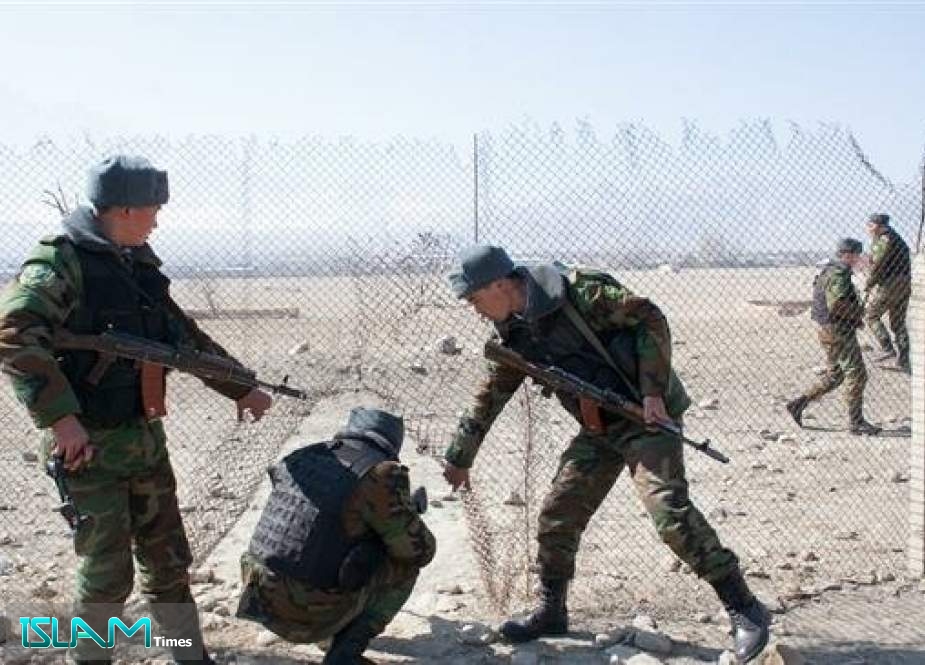 A file photo shows Kyrgyz border guards patrolling the edge of Tajikistan