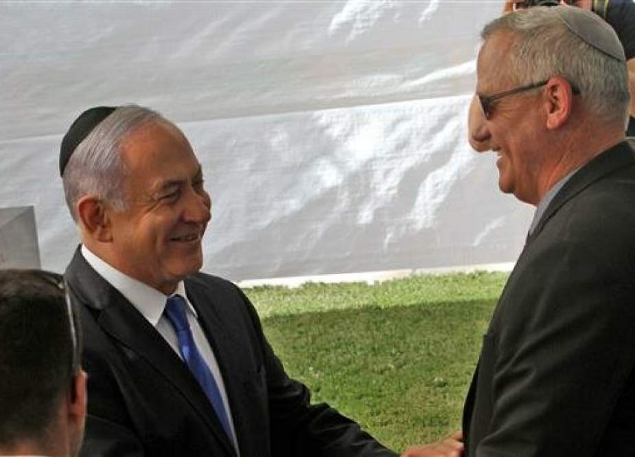 Israeli Prime Minister Benjamin Netanyahu greets Benny Gantz, leader of the Blue and White party in Jerusalem al-Quds.jpg