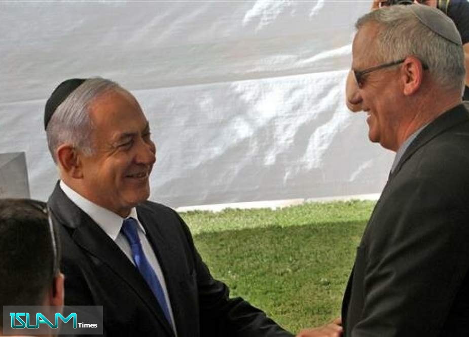 Israeli Prime Minister Benjamin Netanyahu (L) greets Benny Gantz, leader of the Blue and White party in Jerusalem al-Quds