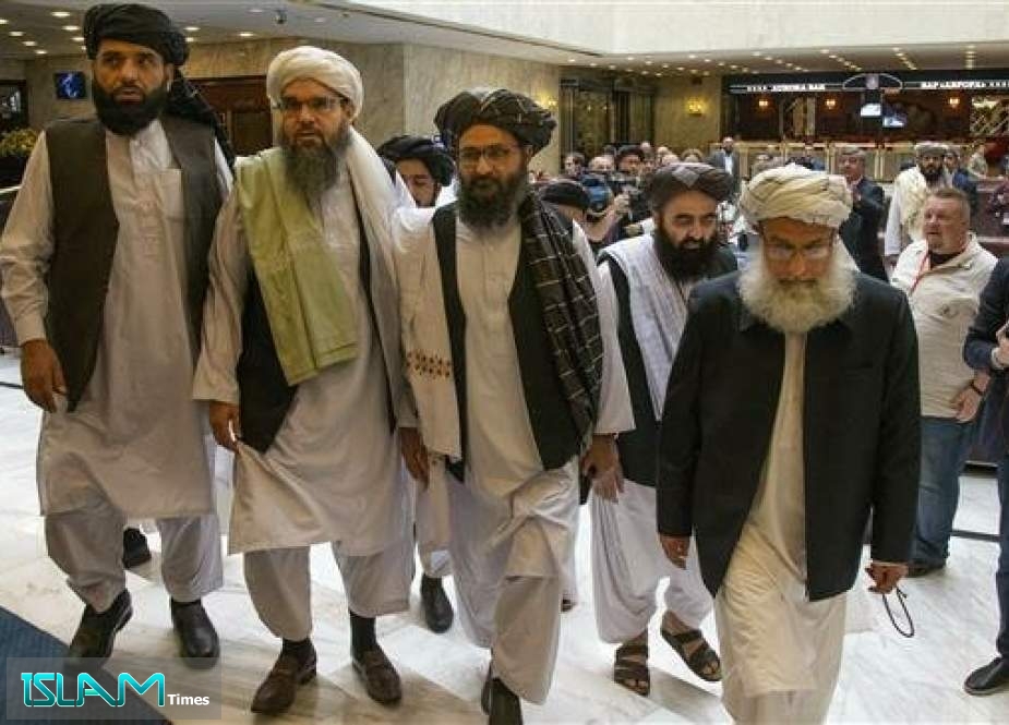 In this May 28, 2019 file photo, Mullah Abdul Ghani Baradar, the Taliban group’s top political leader (3rd-L) arrives with other members of the Taliban delegation for talks in Moscow, Russia.