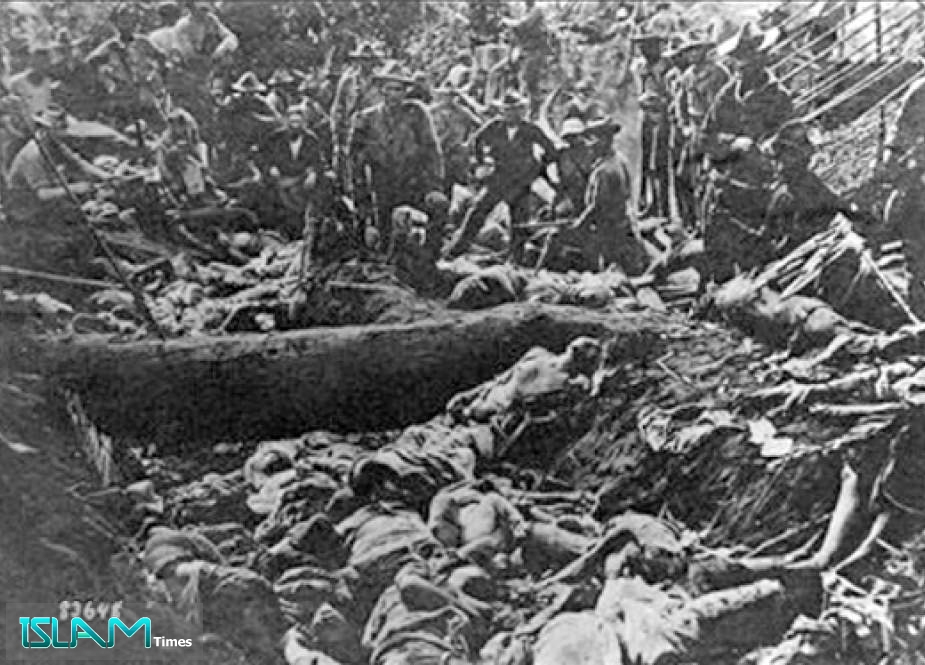 US soldiers pose with Filipino Moro dead after the First Battle of Bud Dajo, March 7, 1906, Jolo, Philippines