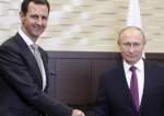 Russian President Vladimir Putin (right) shakes hand with his Syrian counterpart Bashar Assad in the Bocharov Ruchei residence in the Black Sea resort of Sochi, Russia, on November 20, 2017. (Photo by The Associated Press)
