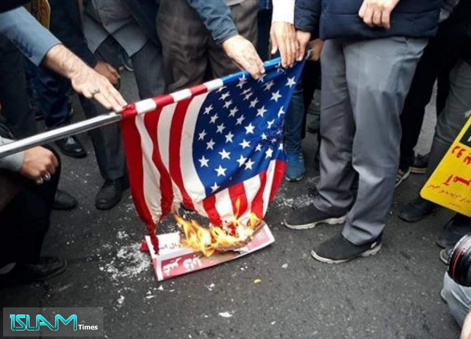 Iranian demonstrators set on fire a United States Stars and Stripes flag during rallies on the 40th anniversary of the former US embassy’s takeover in Tehran