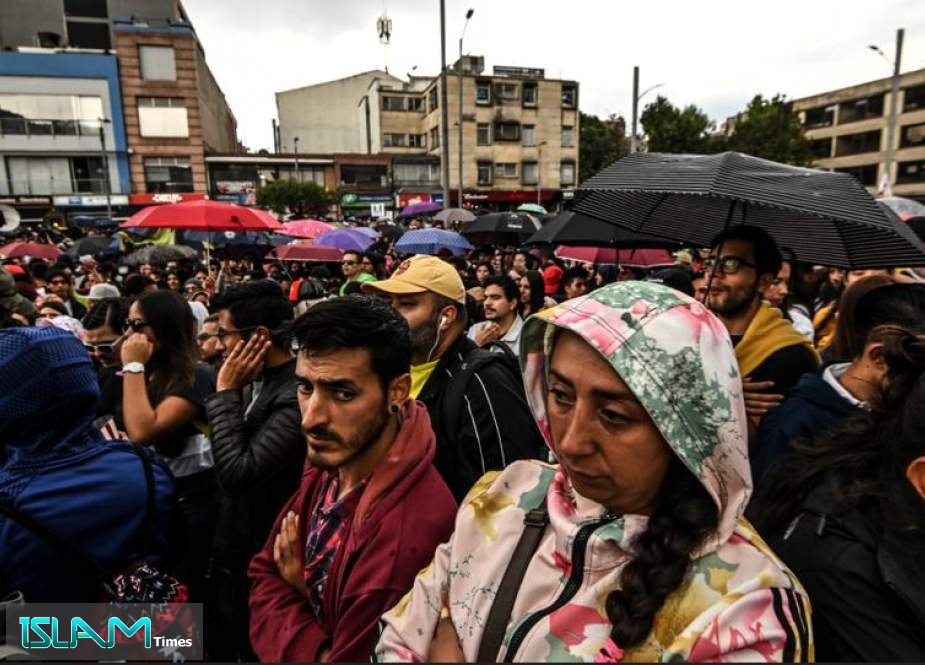 People attend a concert organized by Colombian musicians and artists to support protests against the government of President Ivan Duque in Bogota on December 8, 2019. (AFP)