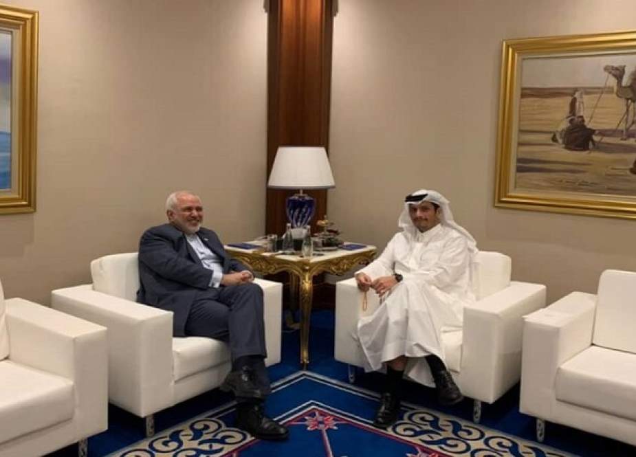 Iranian FM Mohammad Javad Zarif with his Qatari counterpart, Mohammed bin Abdulrahman Al Thani, in Doha.jpeg