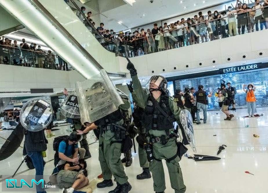 Hong Kong Mall Protests Flare with Leader Lam in Beijing