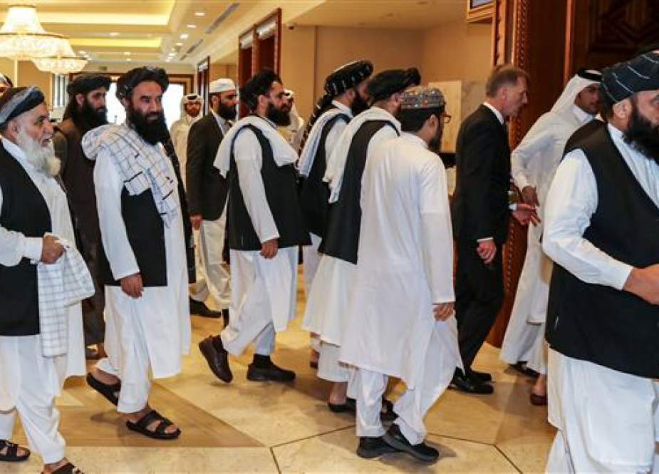 Members of the Taliban arrive to attend talks in the Qatari capital Doha.jpg