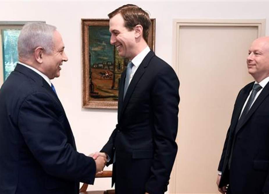 Jared Kushner is shaking hands with Israeli Prime Minister Banjamin.jpg
