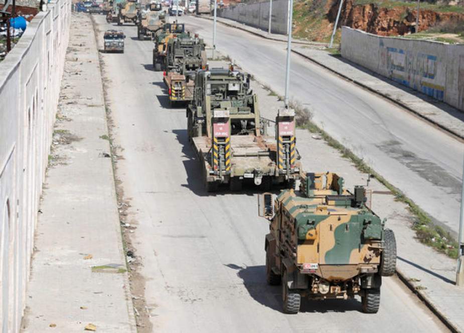 Turkish military convoy of tanks and armored vehicles passes near the city of Idlib, in northwestern Syria.jpg