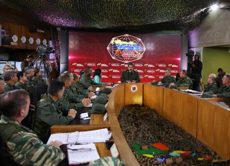 Venezuela’s President Nicolas Maduro with members of the Bolivarian National Armed Forces (FANB), in Caracas.jpg
