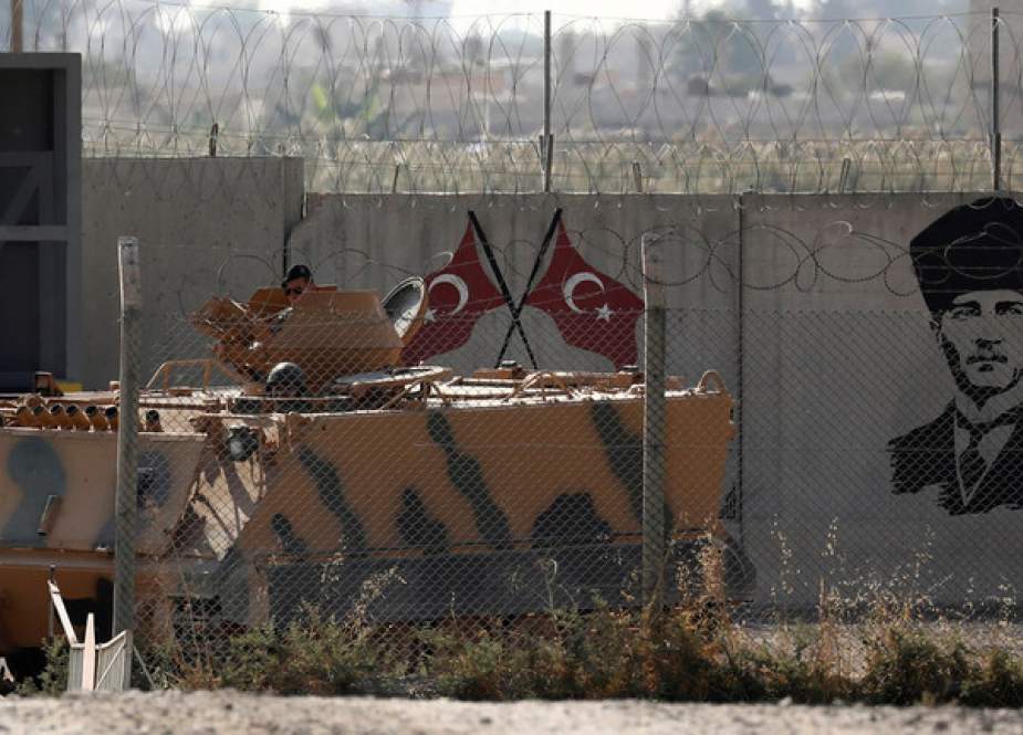 Turkish soldiers in an armored vehicle return from the Syrian town of Tal Abyad.JPG