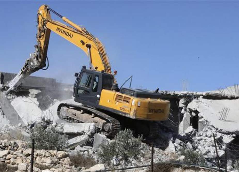 Israeli bulldozer demolishes Palestinian houses near al-Arub camp, West Bank.jpg