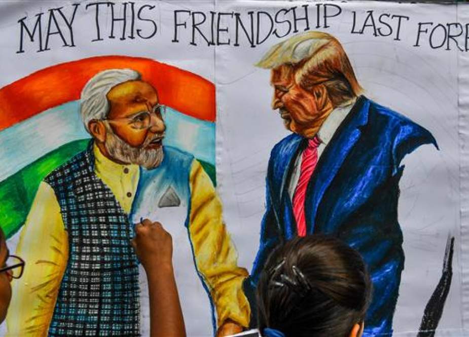 Students paint faces of US President Donald Trump and India