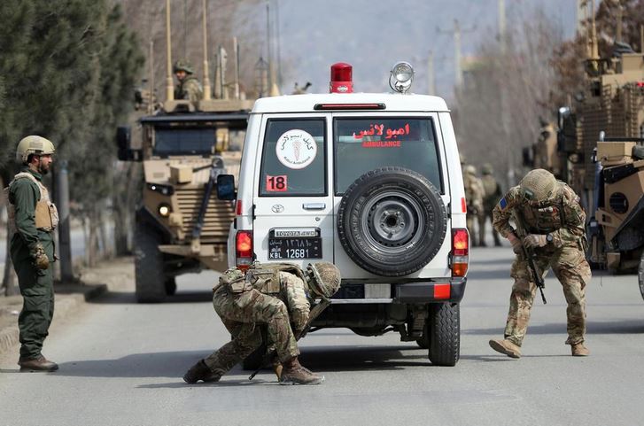 British soldiers with NATO-led Resolute Support Mission forces check an ambulance near the site of an attack in Kabul.