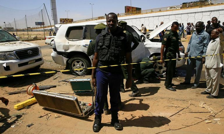 Security personnel stand near a car damaged after an explosion targeting the motorcade of Sudan's Prime Minister Abdallah Hamdok near the Kober Bridge in Khartoum, Sudan. Reuters
