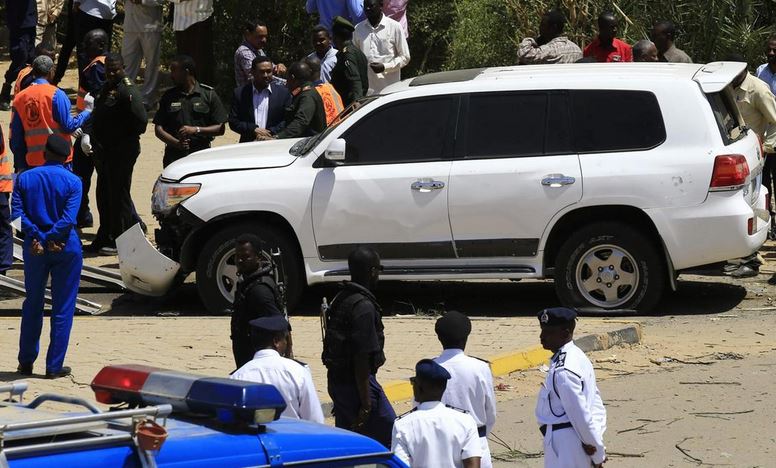 Sudanese rescue teams and security forces gather next to a damaged vehicle at the site of an assassination attempt against Sudan's Prime Minister Abdalla Hamdok, who survived the attack with explosives unharmed, in the capital Khartoum. AFP
