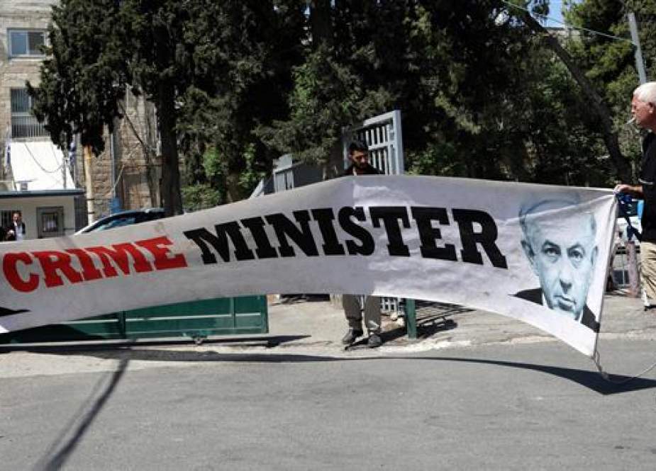 Israeli man protests outside the magistrate’s court in Jerusalem al-Quds.jpg
