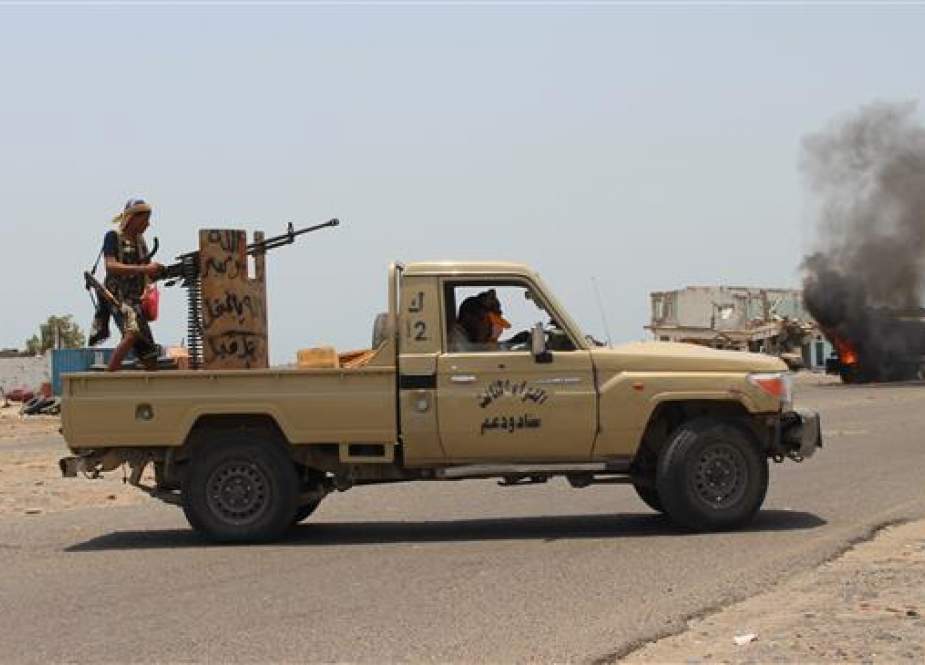 Yemeni southern separatists inspect the site of UAE airstrikes near Aden, Yemen.jpg