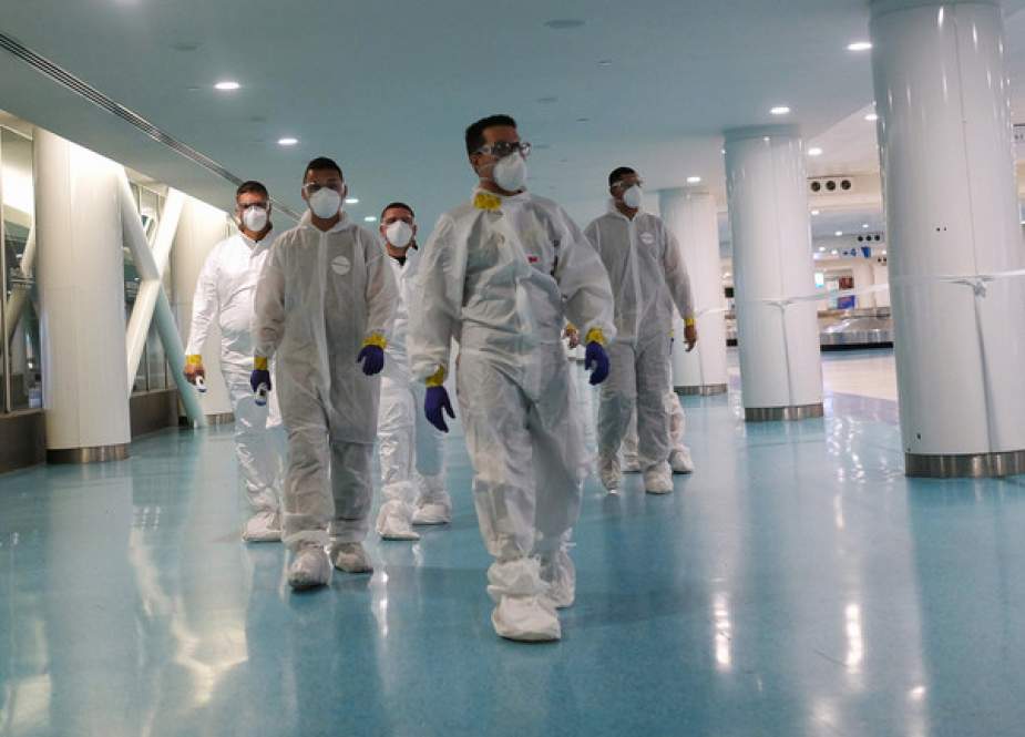 National Guard soldiers dressed with sterile coveralls.JPG