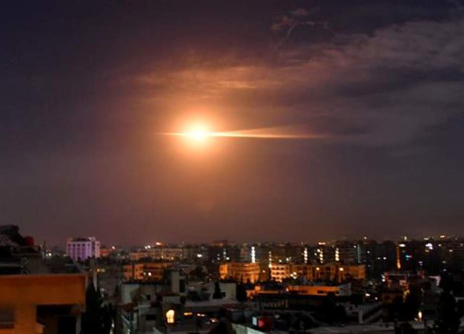 Syrian air defense systems responding to a missile strike in the sky over Damascus.jpg
