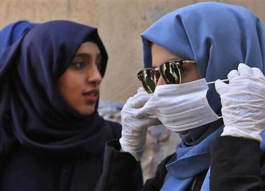 Yemeni women puts on a protective face mask in the Yemeni capital, Sana’a.jpg