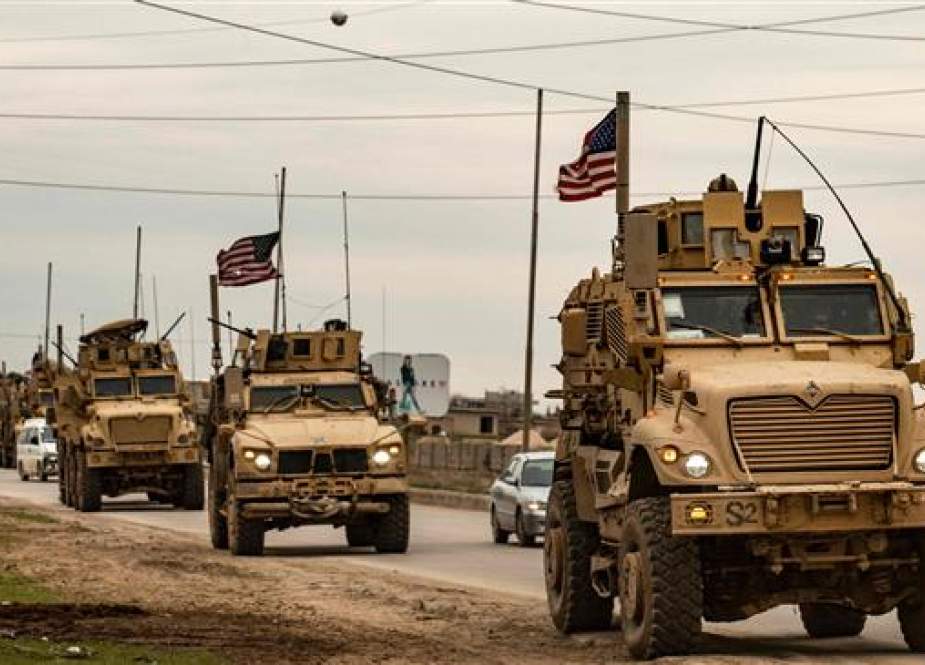 US military convoy drives on the outskirts of the Kurdish-controlled northeastern Syrian city of Qamishli.jpg