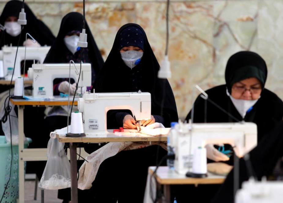 Iranian women make face masks and other protective items at a mosque in the capital Tehran.jpeg