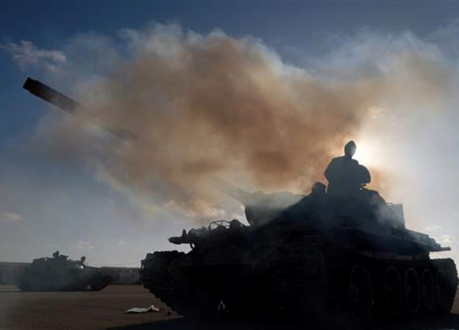 Libyan rebels get ready before heading out of Benghazi.jpg