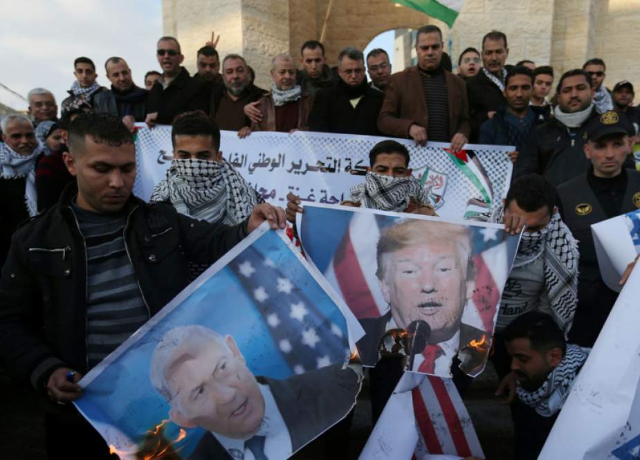 Palestinian protesters burn pictures of Donald Trump and Benjamin Netanyahu.jpg