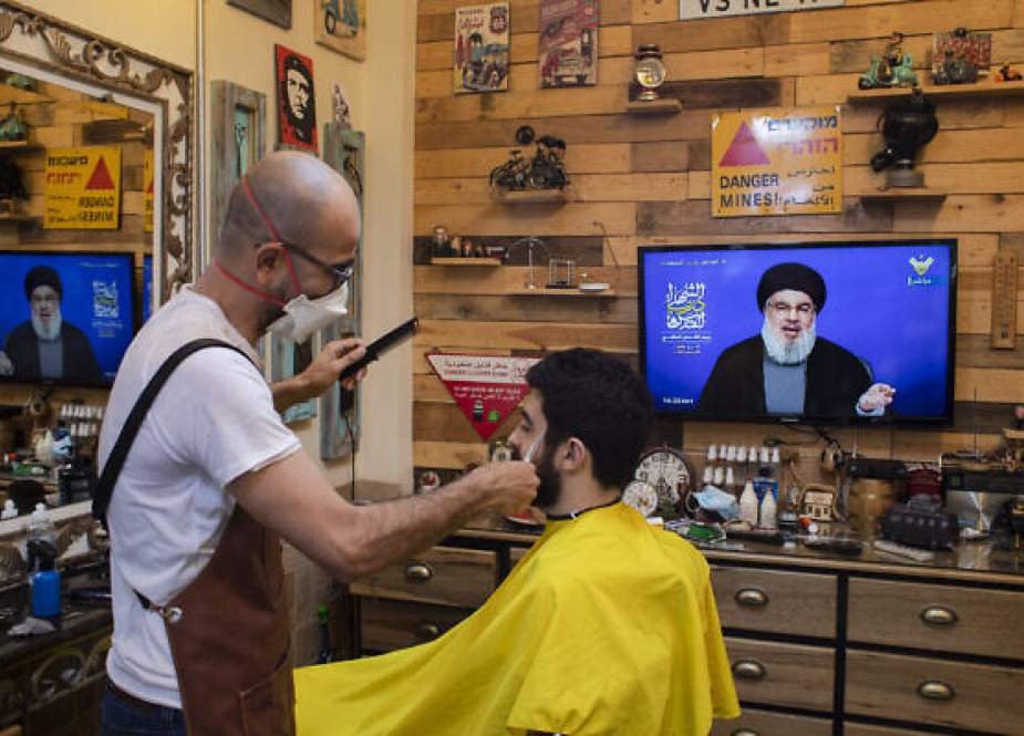 Israeli barber following Sayyed Nasrallah speech during Al-Quds Day.jpg