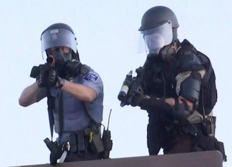 Police aim at a Reuters TV cameraman during nationwide unrest following the death of of George Floyd in Minneapolis.jpeg