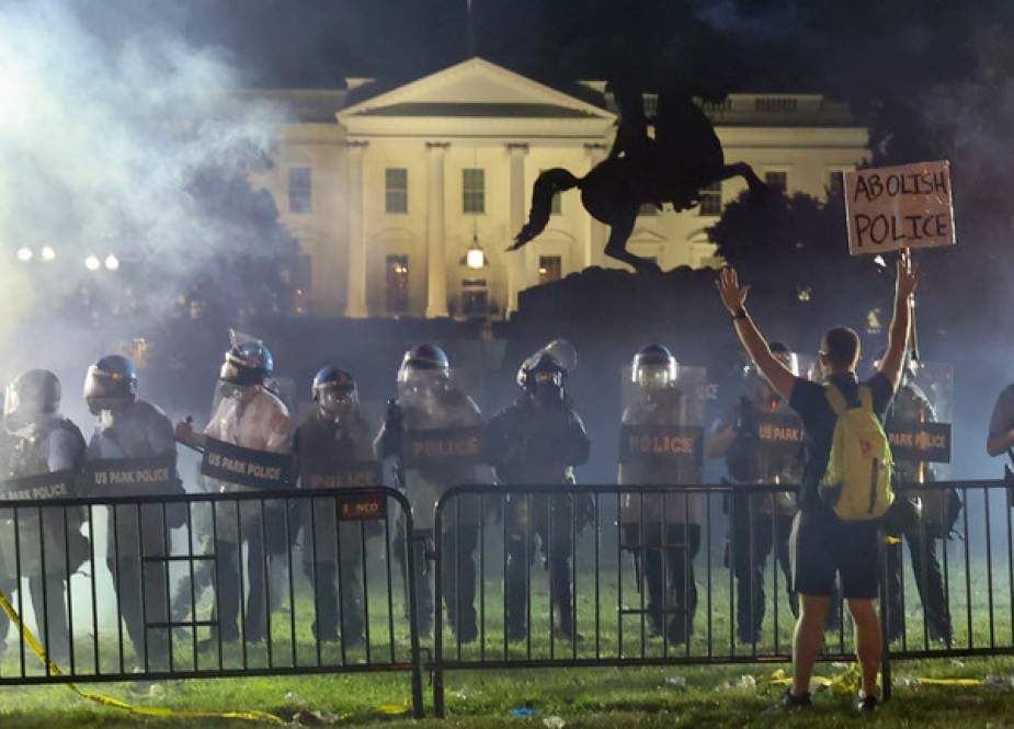 Police in riot gear keep protesters at bay in Lafayette Park near the White House in Washington.JPG