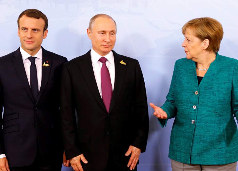 Angela Merkel, Emmanuel Macron and Vladimir Putin during G20 summit in Hamburg, Germany.jpg